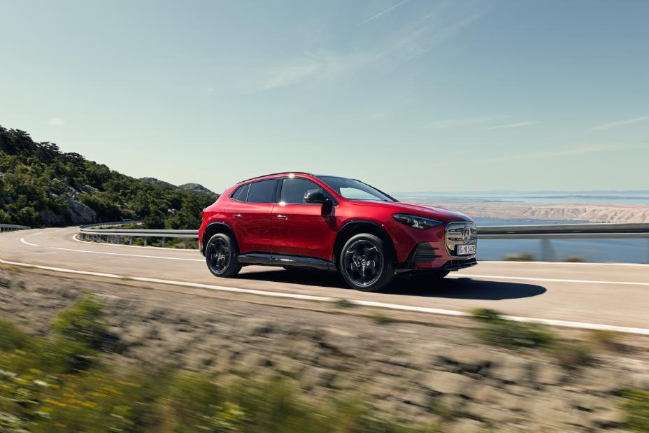 All-new Mercedes-Benz GLA electric SUV traveling on a coastal bridge